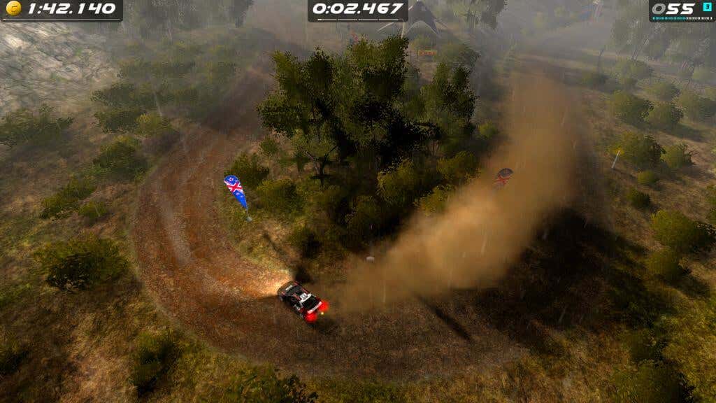 20-best-offline-mobile-games-for-android-15-compressed - Online Tech Tips A screenshot from the game Rush Rally Origins showing the player - 20-best-offline-mobile-games-for-android-15-compressed's car taking a corner leaving a plume of dust behind.